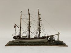 A Vintage treen model of a three masted schooner sailing ship. W43cm