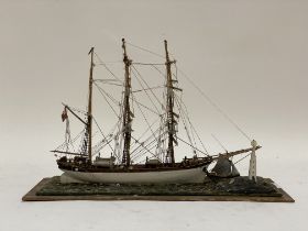 A Vintage treen model of a three masted schooner sailing ship. W43cm