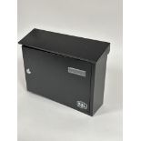 A new SL wall mounting black enamel slope top letter box with panel opening locking door to front