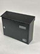A new SL wall mounting black enamel slope top letter box with panel opening locking door to front