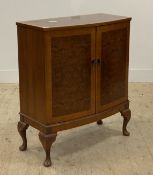 A reproduction cross banded burr walnut bow front cabinet, two doors opening to a void interior,