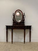 A Victorian style mahogany console table with serpentine front and frieze carved with classical
