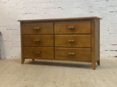 Lahora furniture, a vintage cherry and split cane sideboard, fitted with six drawers, raised on