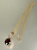 A 9ct gold flat link chain necklace mounted yellow metal oval hoop and pendant set garnet coloured