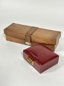 An Edwardian leather bound Glove box with strap fastening H x 7.5cm L x 30cm and a burgundy