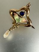 An Edwardian Art Nouveau yellow metal and enameled orchid brooch pendant with fresh water pearl drop