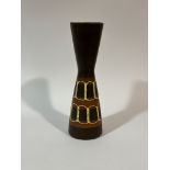 A 20thc West Germany pottery, tall necked vase with brown glaze and yellow circular banded lines