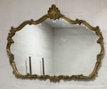 A Rococo style gilt composition framed wall hanging mirror. 91cm x 120cm.