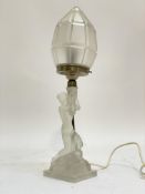 An Art Deco period frosted glass figural table lamp, formed as a semi nude lady holding a torch.