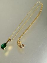 A 18ct gold trace link chain necklace with yellow metal emerald pear shaped stone a/f L x 21cm 3.