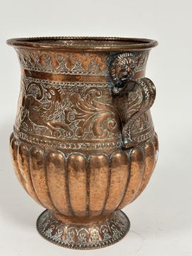 An Eastern copper two handled urn, the rope patterned moulded lip above a scrolling border, with - Image 2 of 2