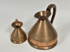 A late 19thc copper half gallon measuring jug and a matching 1/2 pint jug with applied pewter stamps