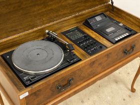 A cross banded burr walnut radiogram by Dynatron, the hinged top opening to a Gerrard 35SB record