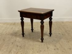 A Victorian mahogany lamp table, the top with moulded edge above frieze drawer and raised on
