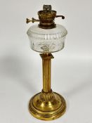 A Victorian brass fluted column oil lamp base with cut glass oil well on weighted stepped circular
