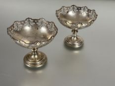 A pair of Birmingham silver pierced stem cheese Sables dishes in turned colums and stepped bases H x