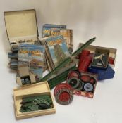 Vintage Toys: A quanitity of Meccano parts, including two clockwork motors, wheels, bearings,