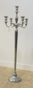 A large stainless steel floor standing candelabra, the central column issuing five branches and