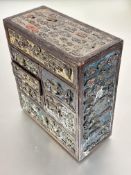 A 1920s Japanese miniature wood chest with an arrangement of two long and four various short drawers