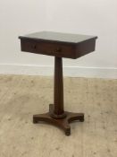 A mid 19th century mahogany pedestal table, the rectangular top above a frieze drawer, above a