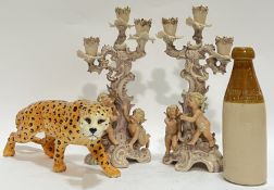 A mixed group of ceramics comprising a pair of Rococo style bisque ware candelabra with putto/cherub