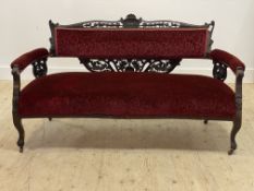 A Victorian walnut framed drawing room sofa, with shell and pierce floral carved crest rail above