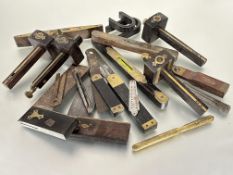 A collection of Edwardian and later wood working hand tools to include four various hardwood brass