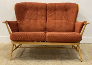 Ercol, a Vintage blonde beech two seat sofa, the hoop and spindle back and shaped arms enclosing red