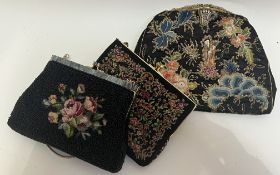 A group of three vintage evening bags comprising a beadwork bag with floral design, an embroidered