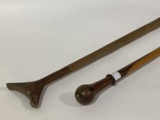 An early 20th century turned exotic hardwood walking stick, (L86cm) together with a Polynesian style