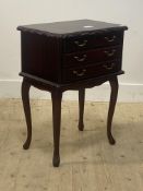 A French style stained hardwood bedside chest, the serpentine top above two short and two long
