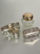An Edwardian glass manicure dish with Birmingham silver nail buffer and lotion dish with matching