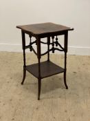 An Edwardian mahogany occasional table, the serpentine top with satinwood cross bands above four