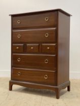 A Stag mahogany chest fitted with a combination of four long and three short drawers, raised on