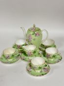 A Foley China 1930s style thirteen piece coffee set decorated with pink and lavender floral sprays