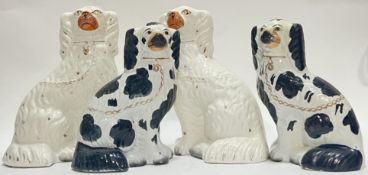 A pair of white Staffordshire type Wally dogs with gilt accents (h- 26cm), together wit another smal