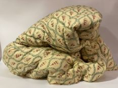 A Vintage Eiderdown or comfy quilt, the fabric with repeating pagoda and running leaf design, (