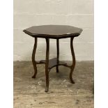 A late Victorian mahogany centre table, the octagonal with moulded edge raised on cabriole