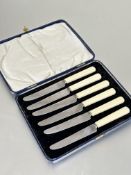 A set of six 1930-40's stainless steel bladed early cream plastic handled tea knives in original