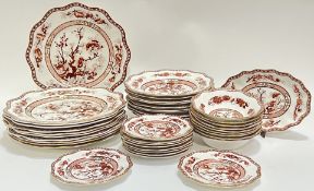 A Coalport 'Indian Tree Coral' part dinner service decorated in iron red with scenes of trees/