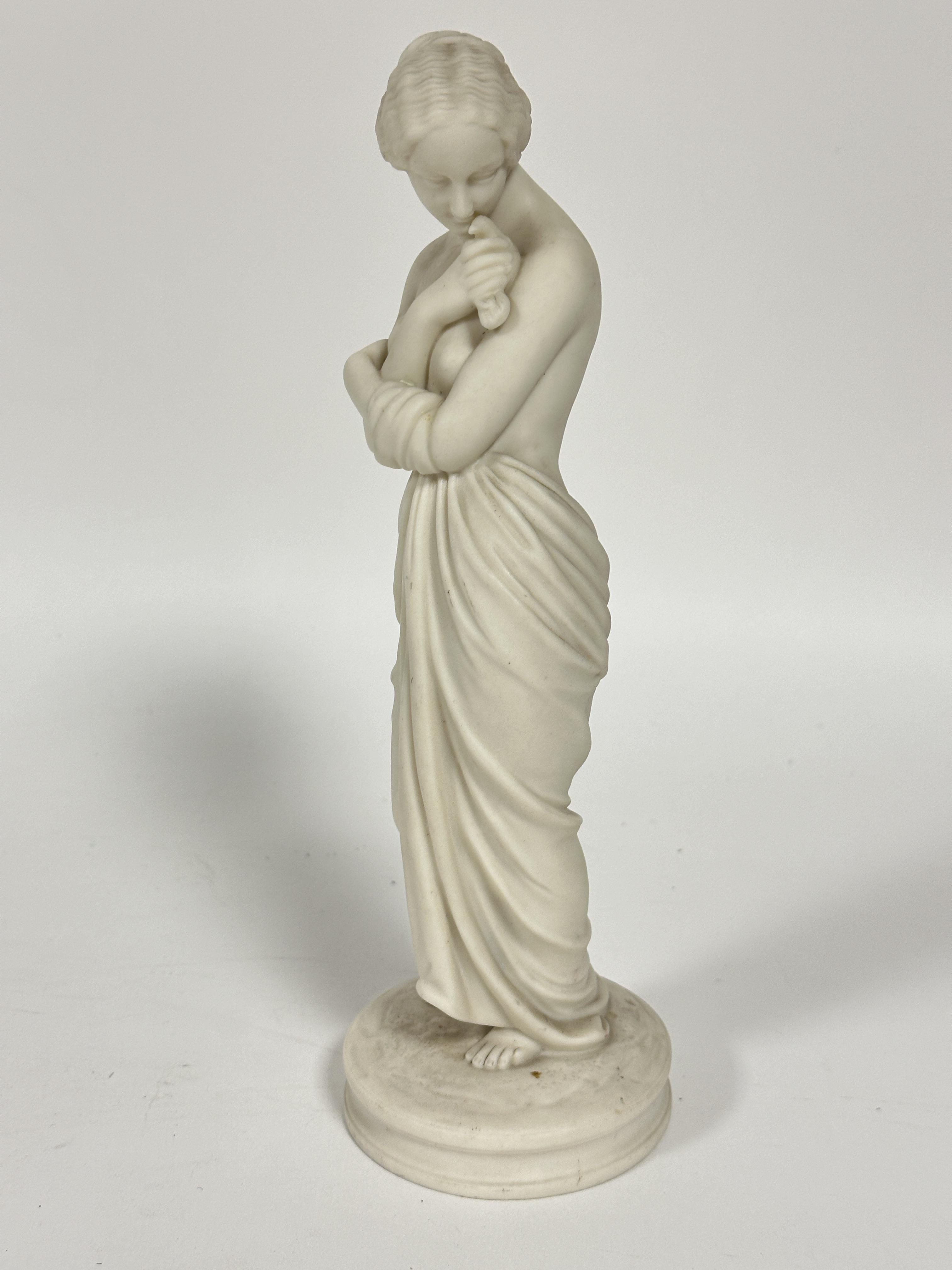 A Royal Worcester Parian ware standing draped figure Joy H x 27cm raised on circular base