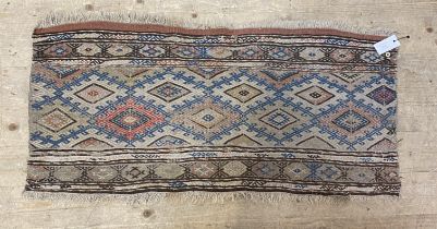 An Antique Caucasian Soumak rug fragment with lozenge motif 103cm x 50cm.
