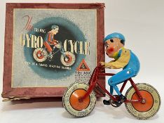 A vintage boxed Tri-Ang Gyro Cycle tin plate mechanical toy