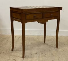 A cherry wood games table, late 20th century, the top inset with maple and ebonised chess board, and