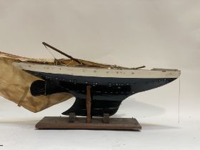 An early 20th century pond yacht on stand, (a/f) L77cm.
