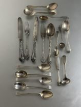 A collection of Georgian and later silver flatware to include an early set of five Georgian tea