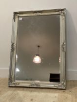 An 18th century style wall silvered composition wall hanging mirror with silvered frame 74cm x