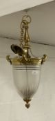 An Edwardian gilt brass hanging hall lantern, with an inverted cut and etched glass dome, complete