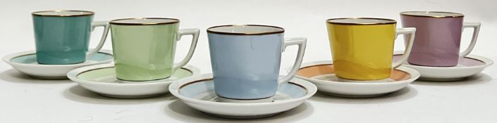 A Royal Copenhagen porcelain part Harlequin espresso set comprising five cups and saucers in various