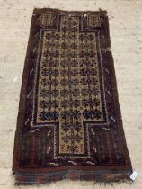 An antique Afghan prayer rug, the beige field of repeating geometric floral design and bordered.